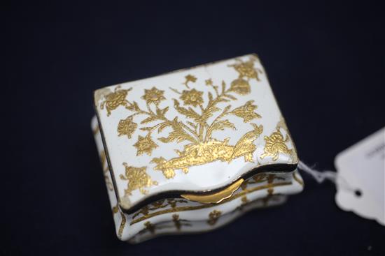 A late 18th / early 19th century French gilt metal mounted commode shaped white enamel snuff box, 3in.